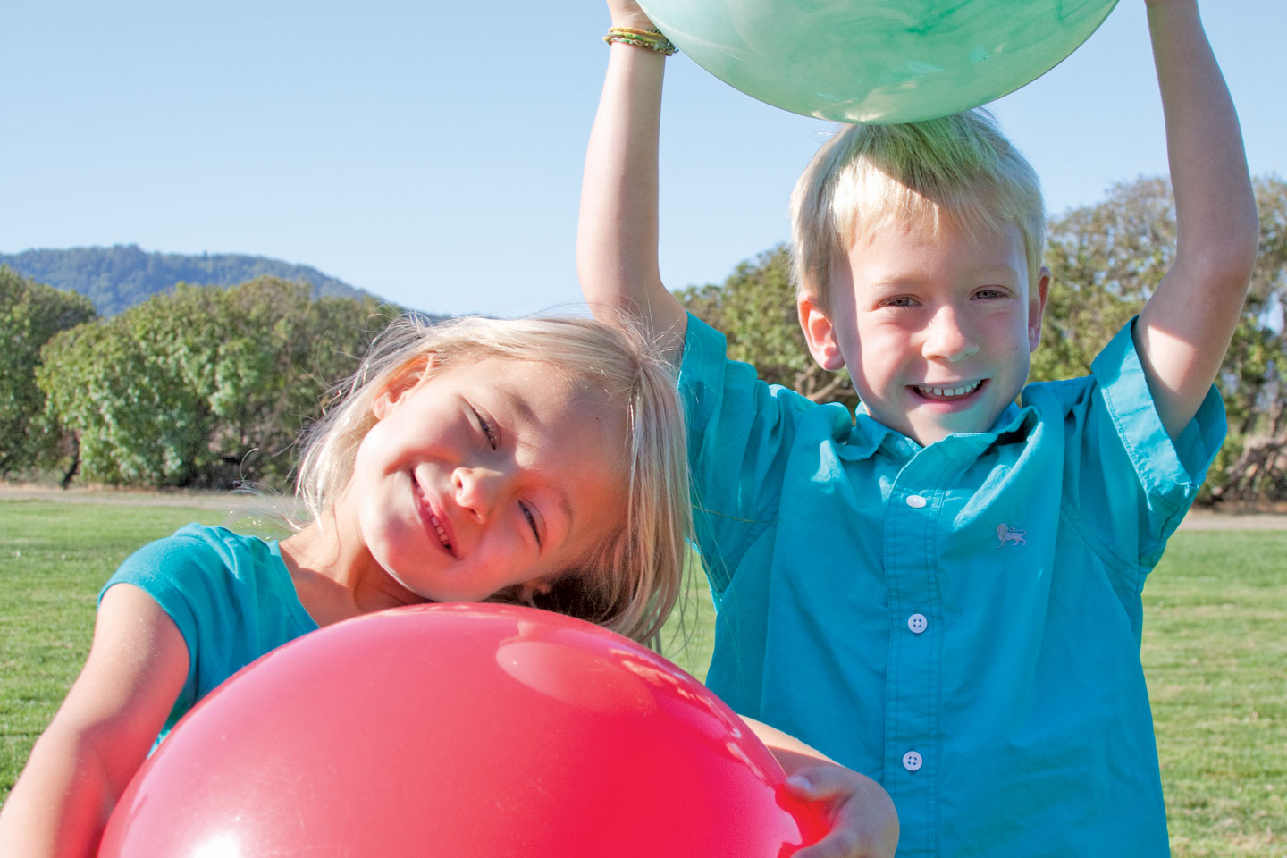 boy and girl with balls